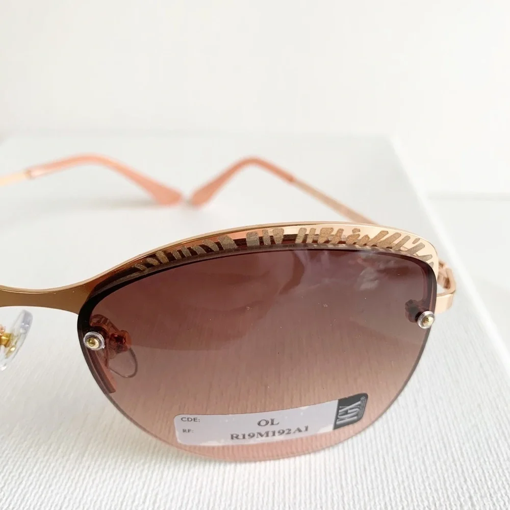 NWT pink and rose gold semi rimless sunglasses
